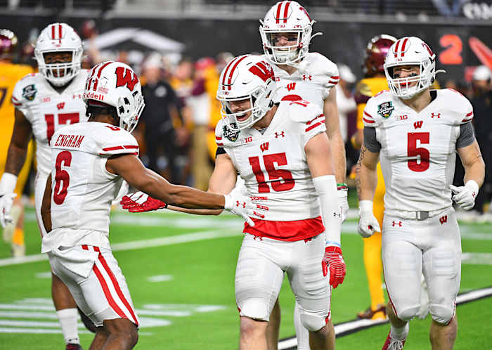 Wisconsin safety John Torchio celebrating in the Las Vegas Bowl after an interception (Credit: Stephen R. Sylvanie-USA TODAY Sports)